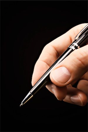 Close-up of Man's Hand holding Fountain Pen Stock Photo - Premium Royalty-Free, Code: 600-03448790