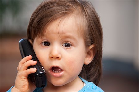 Little Boy Using Cell Phone, Mannheim, Baden-Wurttemberg, Germany Stock Photo - Premium Royalty-Free, Code: 600-03456200