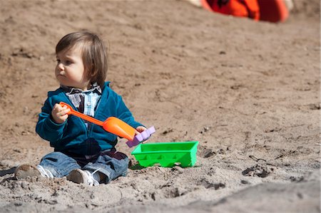 dig sand - Little Boy Playing in Sand Stock Photo - Premium Royalty-Free, Code: 600-03456233