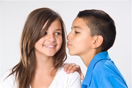 preteen boys smile long hair side - Girl and Boy Kissing Stock Photo - Premium Royalty-Free, Code: 600-03456254