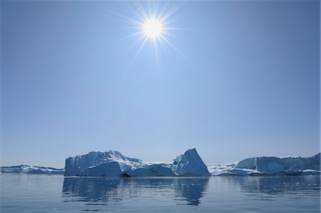 Sun Over Iceberg in Disko Bay, Jakobshavn Glacier, Ilulissat, Greenland Stock Photo - Premium Royalty-Free, Code: 600-03456572