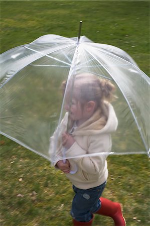 rubber boots grass - Little Girl With Umbrella Stock Photo - Premium Royalty-Free, Code: 600-03456694