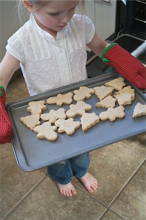 sweet treat - Little Girl Baking Christmas Cookies Stock Photo - Premium Royalty-Free, Code: 600-03456693