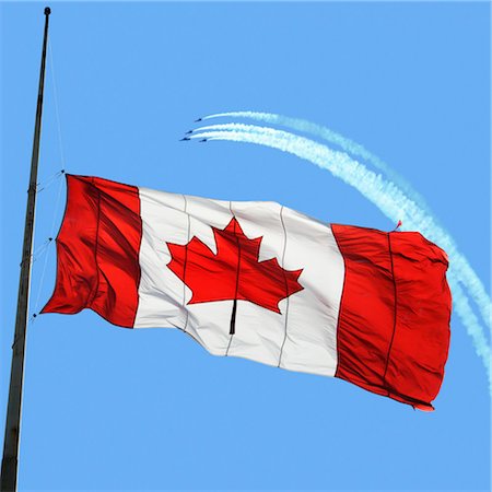 simsearch:700-02686043,k - Canadian Flag at Half Mast, Snowbirds in the Background Stock Photo - Premium Royalty-Free, Code: 600-03456712