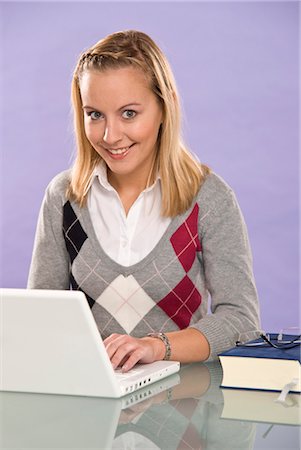 smiling teenage school girls - Woman Using Laptop Stock Photo - Premium Royalty-Free, Code: 600-03456814