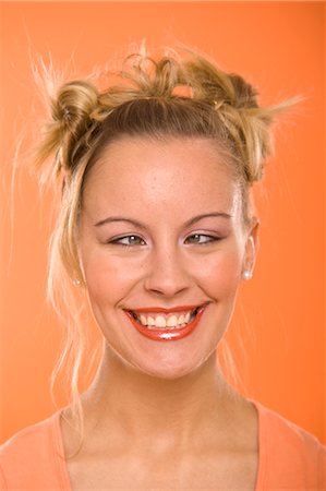 fondo anaranjado - Woman Making Faces Foto de stock - Sin royalties Premium, Código: 600-03456819