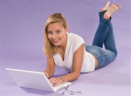simsearch:700-06553298,k - Young Woman Using Laptop Computer Stock Photo - Premium Royalty-Free, Code: 600-03451508