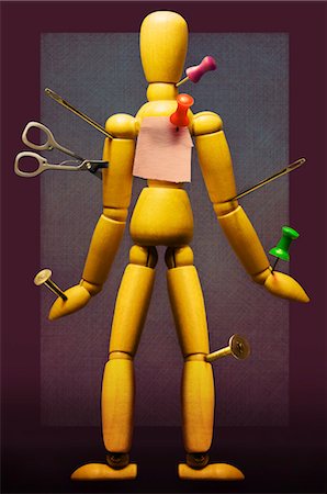 Sewing Needles, Scissors and Thumbtacks inserted into Artist's Mannequin Stock Photo - Premium Royalty-Free, Code: 600-03466820