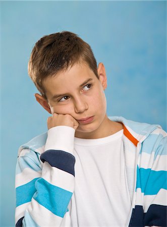 Boy Looking Upset Stock Photo - Premium Royalty-Free, Code: 600-03463155