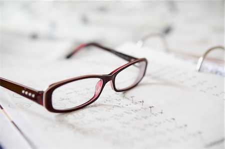 eye wear - Close-up of Eyeglasses on Math Homework Stock Photo - Premium Royalty-Free, Code: 600-03544735