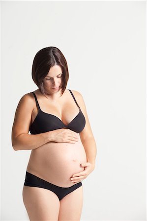 simsearch:600-03451343,k - Portrait of Eight Months Pregnant Woman Stock Photo - Premium Royalty-Free, Code: 600-03556613