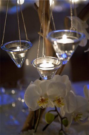 flame lights flower centrepiece - Candles and Flowers on Table at Wedding Stock Photo - Premium Royalty-Free, Code: 600-03567876