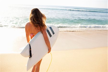 Woman Holding Surfboard, Baja California Sur, Mexico Stock Photo - Premium Royalty-Free, Code: 600-03586482