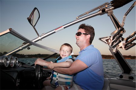 family in the sunset - Father and Son in Speedboat Stock Photo - Premium Royalty-Free, Code: 600-03587108