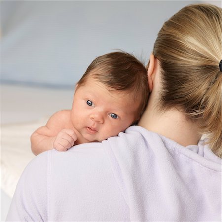 simsearch:600-06752382,k - Baby on Mother's Shoulder Fotografie stock - Premium Royalty-Free, Codice: 600-03587167