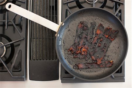 frying pan with bacon - Burnt Bacon, Portland, Oregon, USA Stock Photo - Premium Royalty-Free, Code: 600-03601348