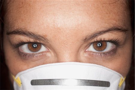 simsearch:600-03638626,k - Close-up of Woman Wearing a Face Mask Foto de stock - Sin royalties Premium, Código: 600-03616054