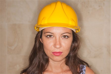 Portrait of Woman Wearing a Hard Hat Stock Photo - Premium Royalty-Free, Code: 600-03616053