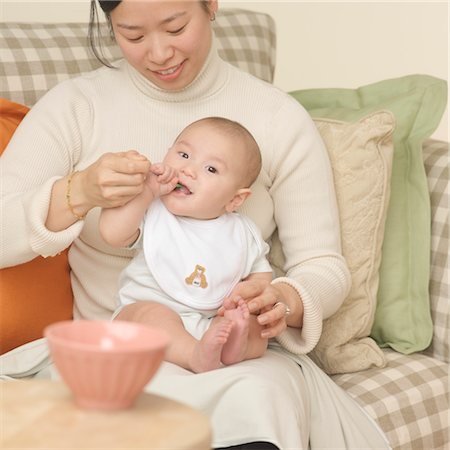 feeding asian family - Mother Feeding Baby Stock Photo - Premium Royalty-Free, Code: 600-03621237