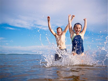 swimming children - Boy and Girl Playing, Lake Wanapitei, Sudbury, Ontario, Canada Stock Photo - Premium Royalty-Free, Code: 600-03621295