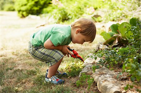 Boy Gardening, Domaine de l'Ardagnole, Fajac-en-Val, Languedoc Roussillon, France Stock Photo - Premium Royalty-Free, Code: 600-03644822