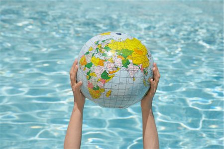 earth and hand - Woman Holding Inflatable Globe, Sanary-sur-Mer, Var, Provence, Provence-Alpes-Cote d'Azur, France Stock Photo - Premium Royalty-Free, Code: 600-03644928