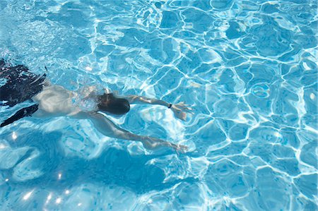 swimmers in pool from above - Man Swimming, Cannes, Provence, Provence-Alpes-Cote d'Azur, France Stock Photo - Premium Royalty-Free, Code: 600-03644950