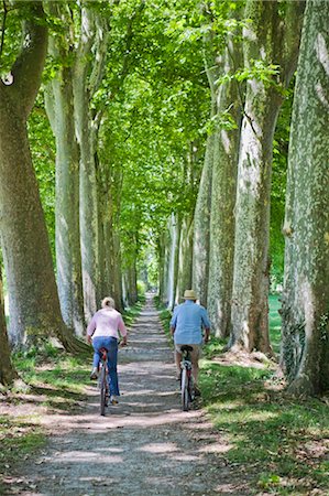 senior couple riding bicycles - Couple Riding Bicycles, France Stock Photo - Premium Royalty-Free, Code: 600-03654644