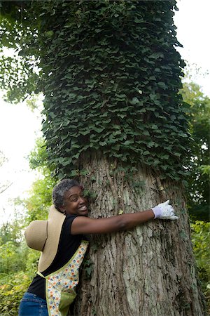 profile of mature woman - Woman Hugging Tree Stock Photo - Premium Royalty-Free, Code: 600-03692075