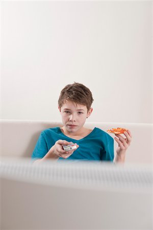 pizza tv - Teenager watching TV Stock Photo - Premium Royalty-Free, Code: 600-03734638