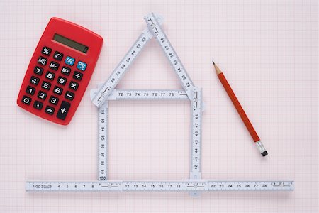 Folding Ruler in Shape of House with Pencil and Calculator Stock Photo - Premium Royalty-Free, Code: 600-03738129