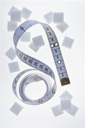 simsearch:600-03782488,k - Sugar Cubes and Measuring Tape Stock Photo - Premium Royalty-Free, Code: 600-03738166