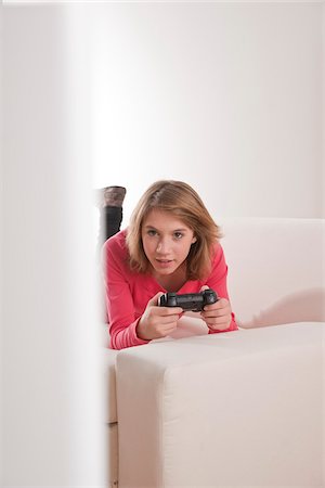 Teenage Girl Playing Video Games, Mannheim, Baden-Wurttemberg, Germany Stock Photo - Premium Royalty-Free, Code: 600-03738190