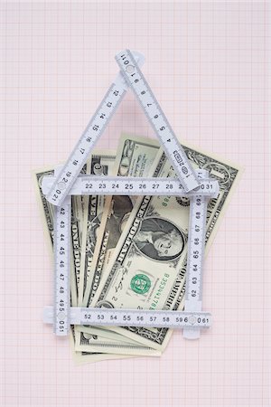 House Made of Expandable Ruler and American Currency on Graph Paper Foto de stock - Sin royalties Premium, Código: 600-03738818