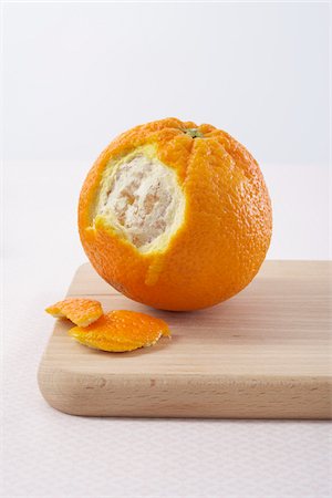 food backdrop - Partially Peeled Orange Stock Photo - Premium Royalty-Free, Code: 600-03762582
