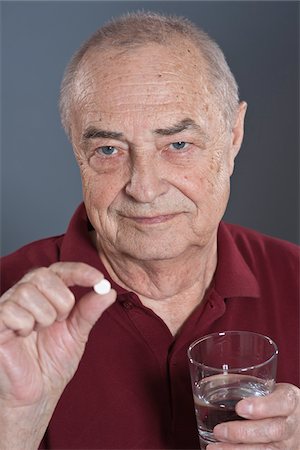 Man Taking Pill Stock Photo - Premium Royalty-Free, Code: 600-03777826
