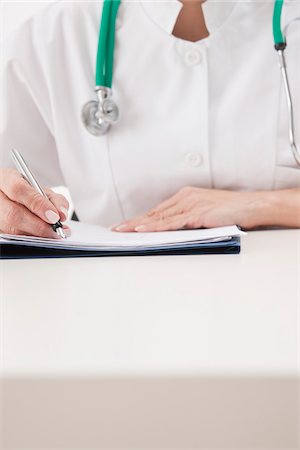 Doctor Writing Notes Stock Photo - Premium Royalty-Free, Code: 600-03777821