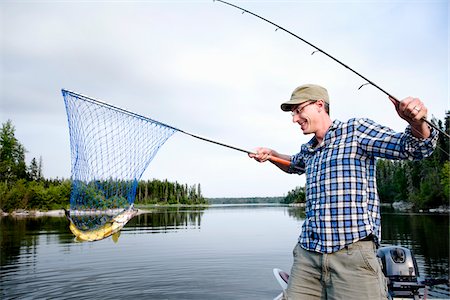 prender - Man Fishing, Otter Lake, Missinipe, Saskatchewan, Canada Foto de stock - Sin royalties Premium, Código: 600-03778010