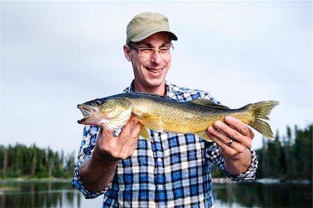 Man Fishing, Otter Lake, Missinipe, Saskatchewan, Canada Foto de stock - Sin royalties Premium, Código: 600-03778011