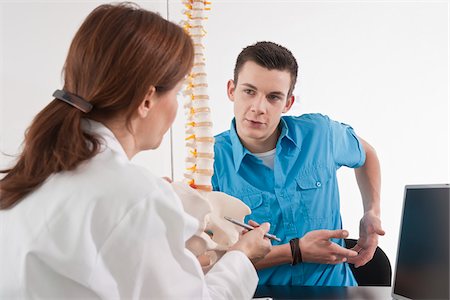 doctor with spine model - Patient with Doctor Stock Photo - Premium Royalty-Free, Code: 600-03778406