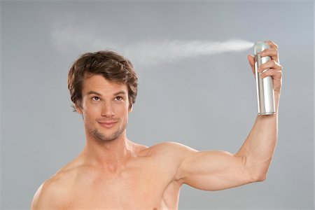 Man Applying Hairspray Fotografie stock - Premium Royalty-Free, Codice: 600-03787516