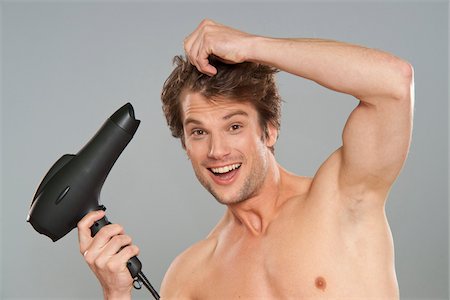 Man Drying his Hair Foto de stock - Sin royalties Premium, Código: 600-03787512