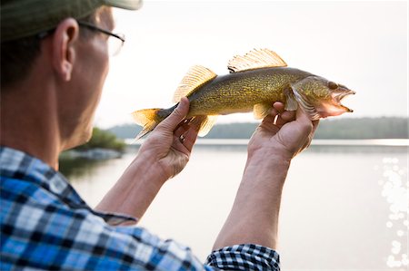 Man Fishing, Missinipe, Otter Lake, Saskatchewan, Canada Foto de stock - Sin royalties Premium, Código: 600-03787592