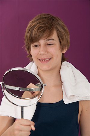 preteen boys in a towel - Boy Looking in Mirror Stock Photo - Premium Royalty-Free, Code: 600-03799488