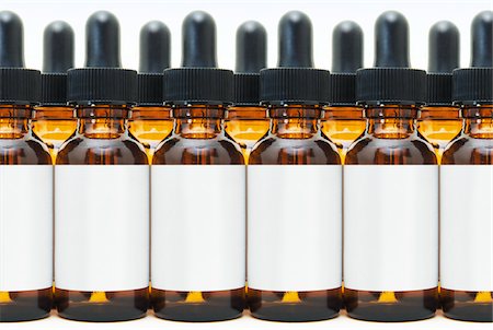 full - Rows of Eye Dropper Bottles Stock Photo - Premium Royalty-Free, Code: 600-03814118