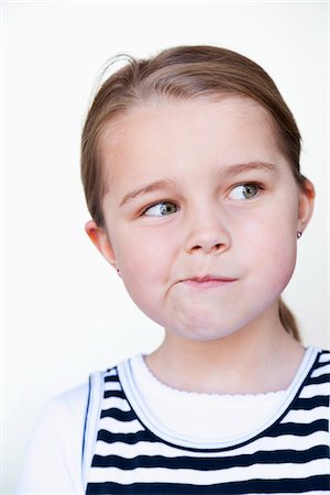 Portrait of Girl Thinking Stock Photo - Premium Royalty-Free, Code: 600-03821109