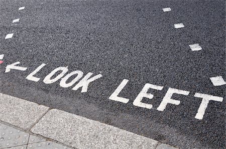 street sign - Look Left Warning at Crossing on Road Foto de stock - Sin royalties Premium, Código: 600-03836136