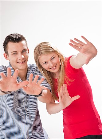 simsearch:600-03836339,k - Teenagers Holding up Hands Foto de stock - Sin royalties Premium, Código: 600-03836339