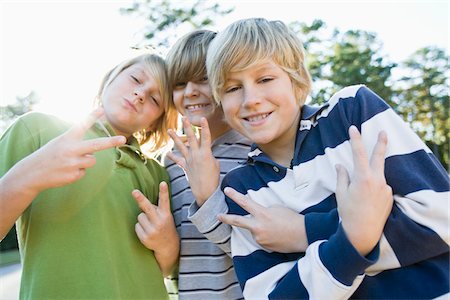 Boys Making Hand Gestures Stock Photo - Premium Royalty-Free, Code: 600-03848741