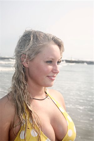 Portrait of Young Woman on Beach, Galveston Beach, Galveston, Texas, USA Stock Photo - Premium Royalty-Free, Code: 600-03849056